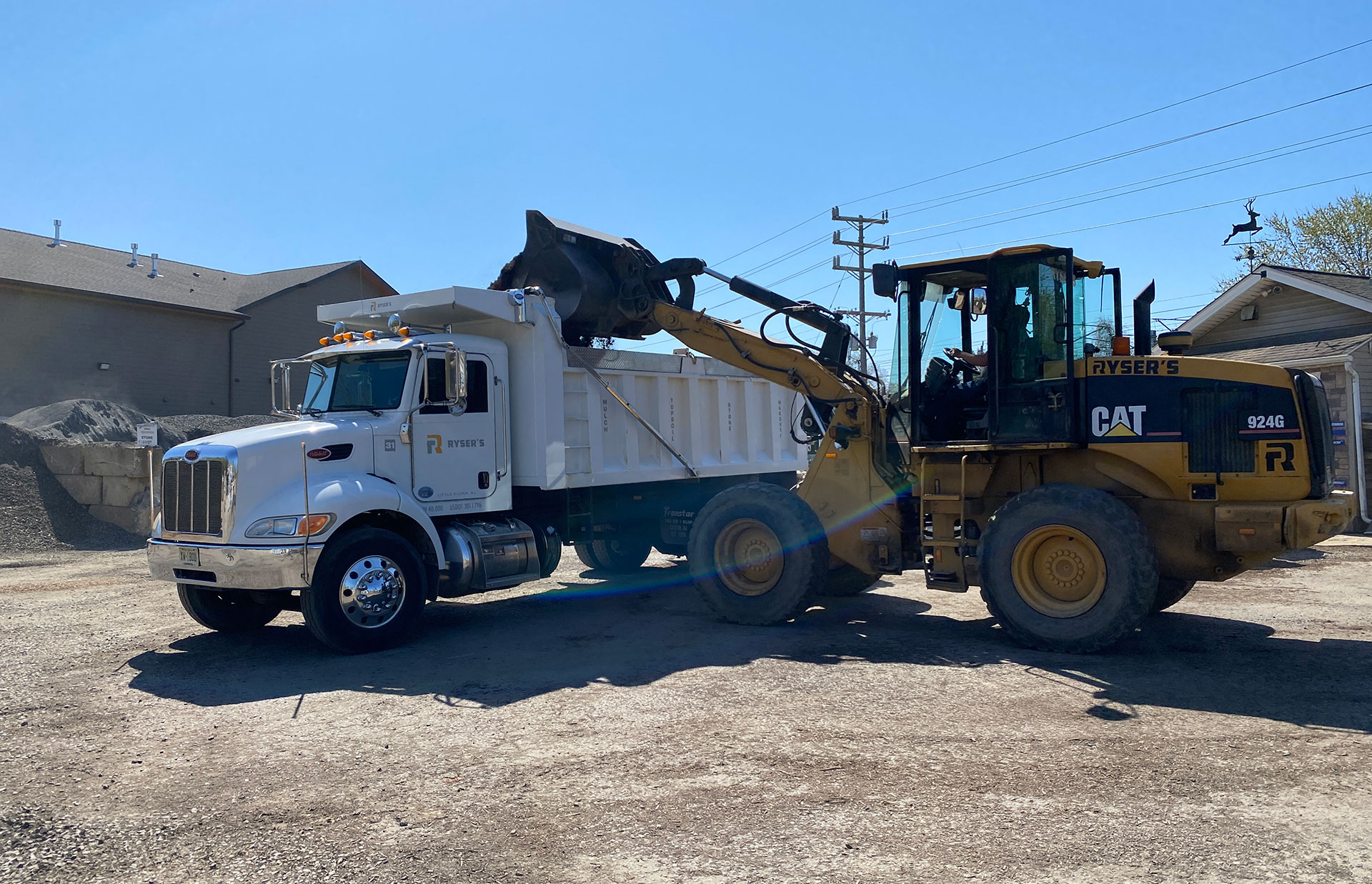 Ryser's loader filling a bulk material truck at the Little Silver supply yard