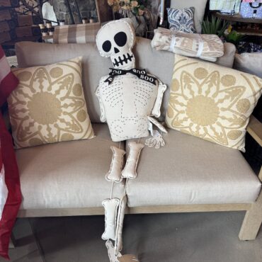 Decorative pillows and seasonal textiles on a showroom sofa